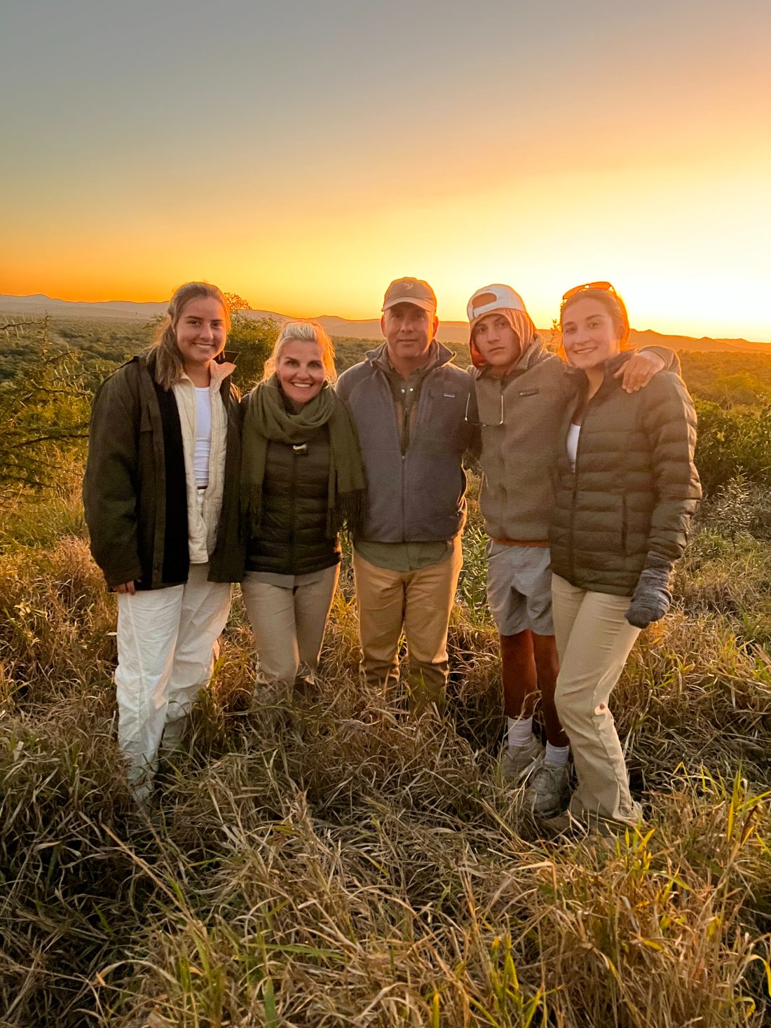 Family at sunset on safari