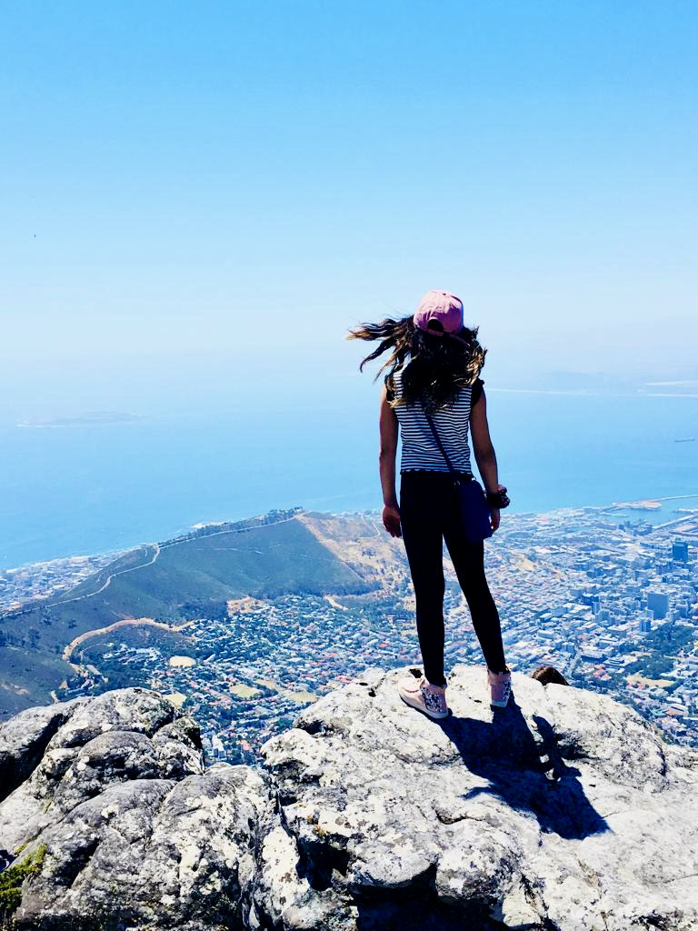 A young traveler atop Table Mountain looking out over Cape Town