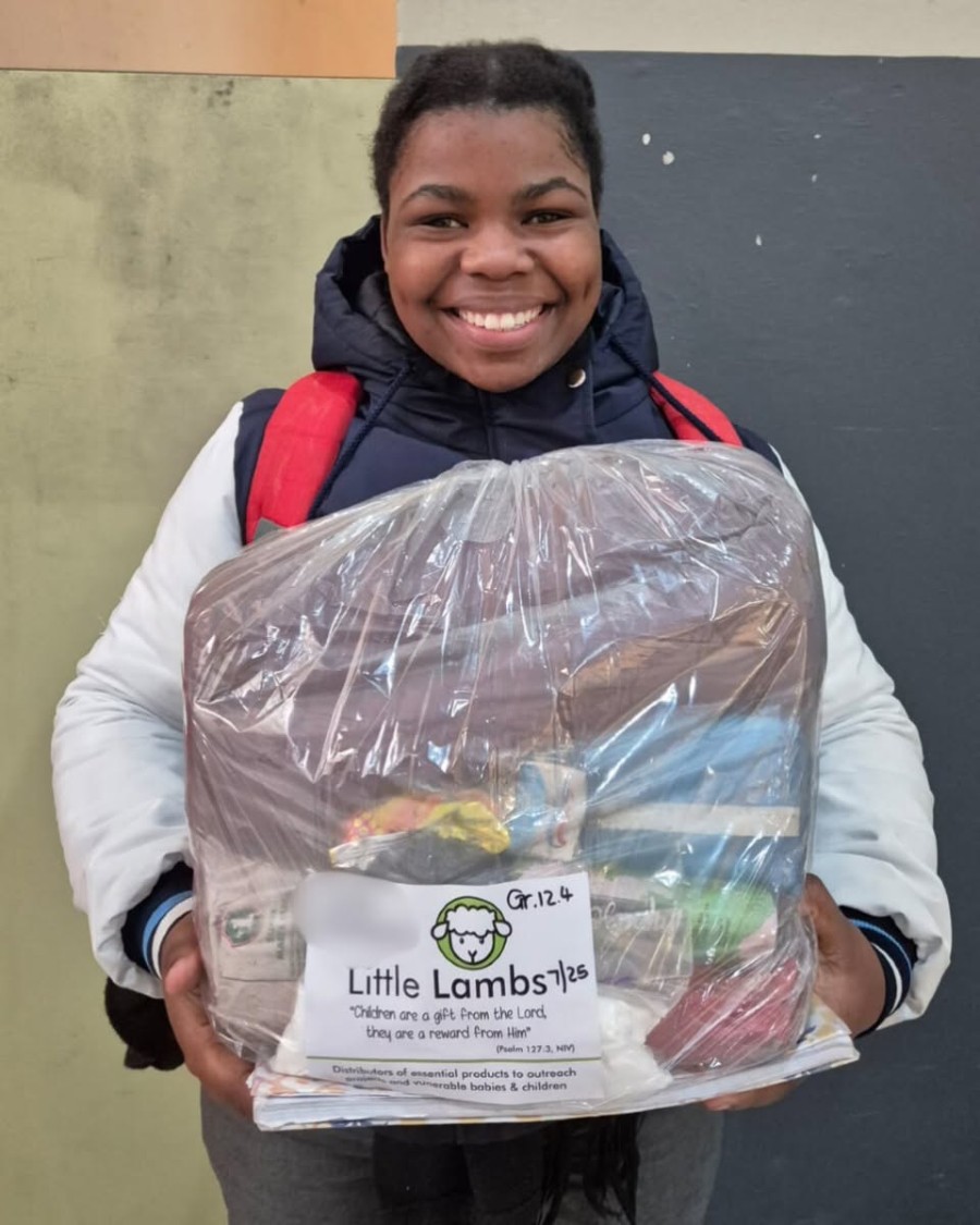A student with a Little Lambs care package