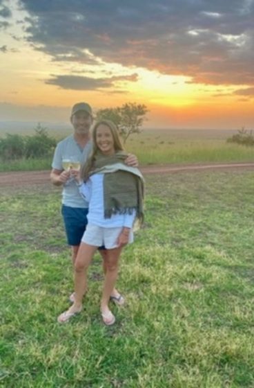 A couple toasting a Mara sunset
