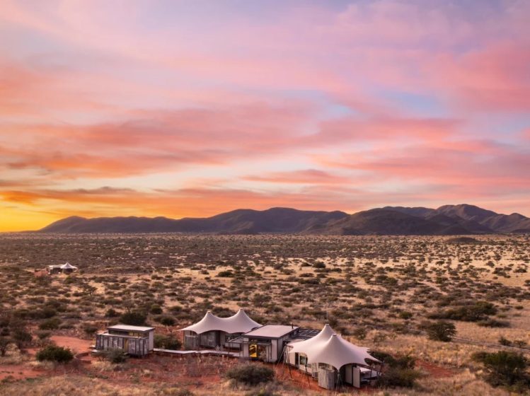 Tswalu Loapi tented camp under a pink Kalahari sunset