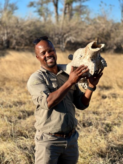 A guide sharing a buffalo skull