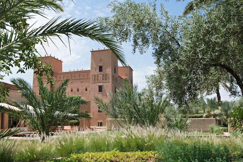 An earthen kasbah among palm gardens in Morocco