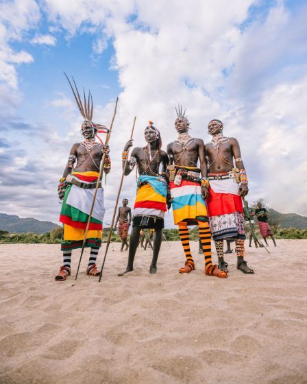 Samburu warriors in beadwork on the sand, Kalepo Kenya