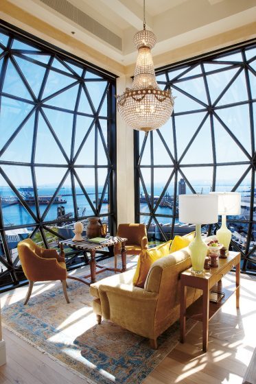 A suite with harbor views through geometric windows, The Silo Cape Town