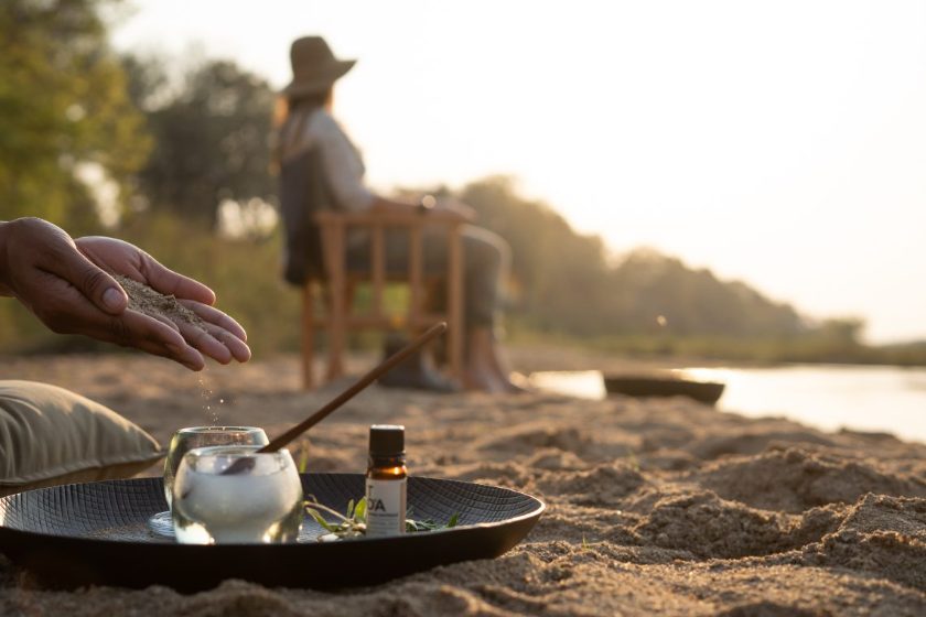 A riverbank wellness ritual at sunset, Singita Sabi Sand